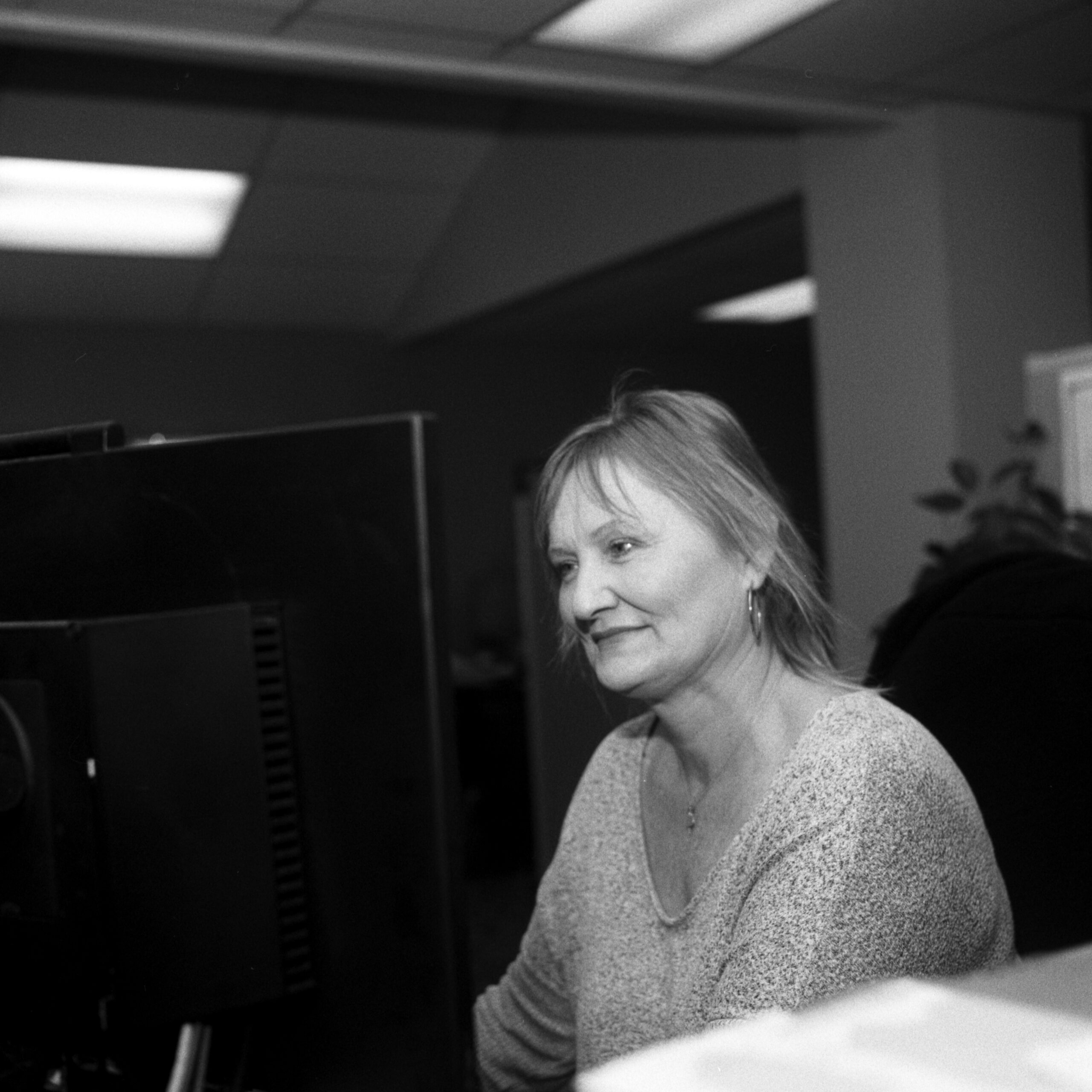 Photo of Diana Parkhill of Stroud National Agency, Inc. at her desk. © 2023 Mike Garretson. All rights reserved.