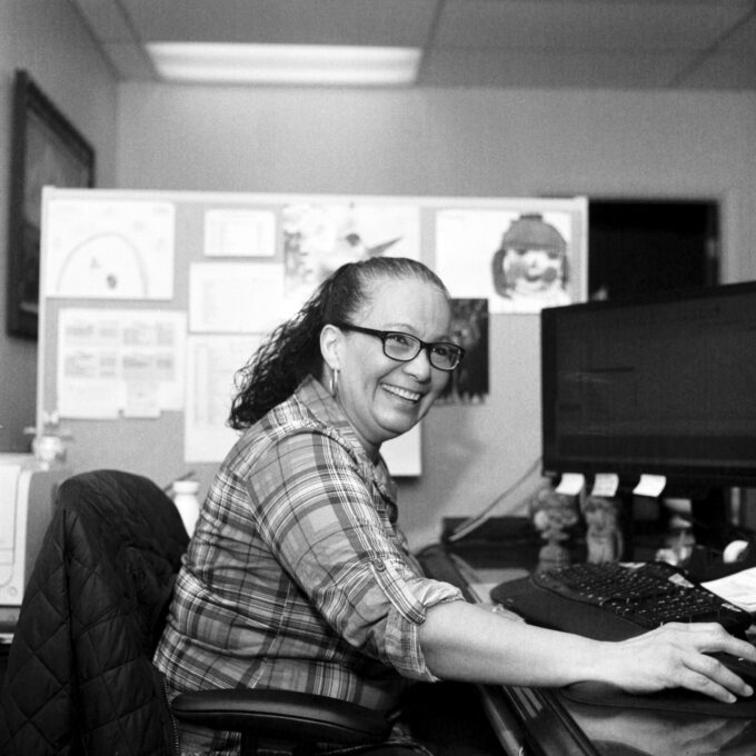 Photo of Margaret Rivera of Stroud National Agency Inc.. working at her desk. © 2023 Mike Garretson. All rights reserved.