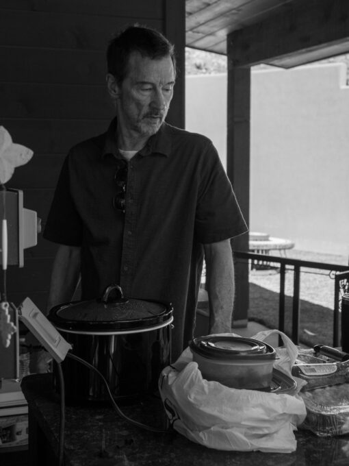 Photo of Chief of Staff Brad Smith thinking through the game plan or grilling success at the 2023 Stroud National Agency, Inc. Summer Cookout. © 2023 Stroud National Agency, Inc. All rights reserved.