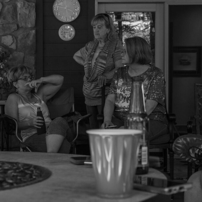 Photo of Irrigation Underwriter & Claims Specialist Shannon Thompson (left), Traveler's Endorsements Underwriter Lynelda Cypher (center), and Senior Commercial Lines Underwriter Cathy Lee (right) in conversation at the 2023 Stroud National Agency, Inc. Summer Cookout. © 2023 Stroud National 